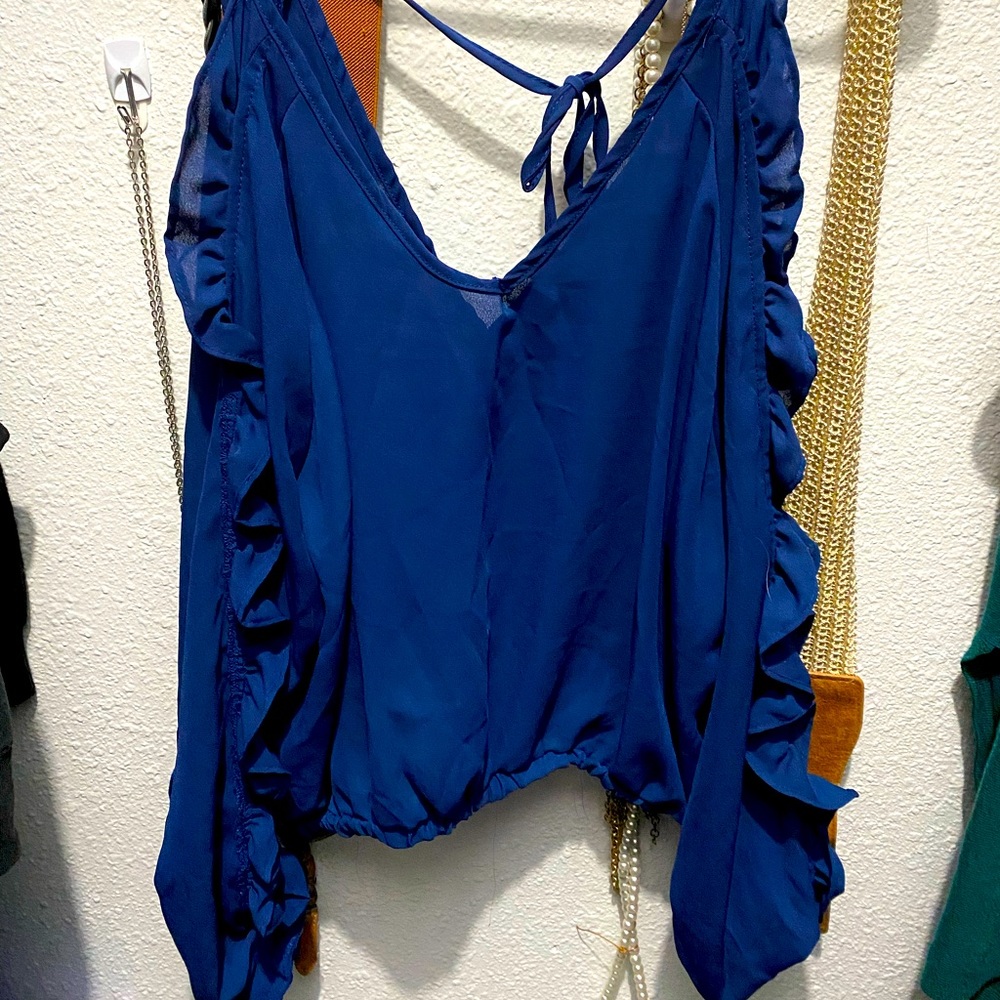 Ruffled blue off-shoulder blouse